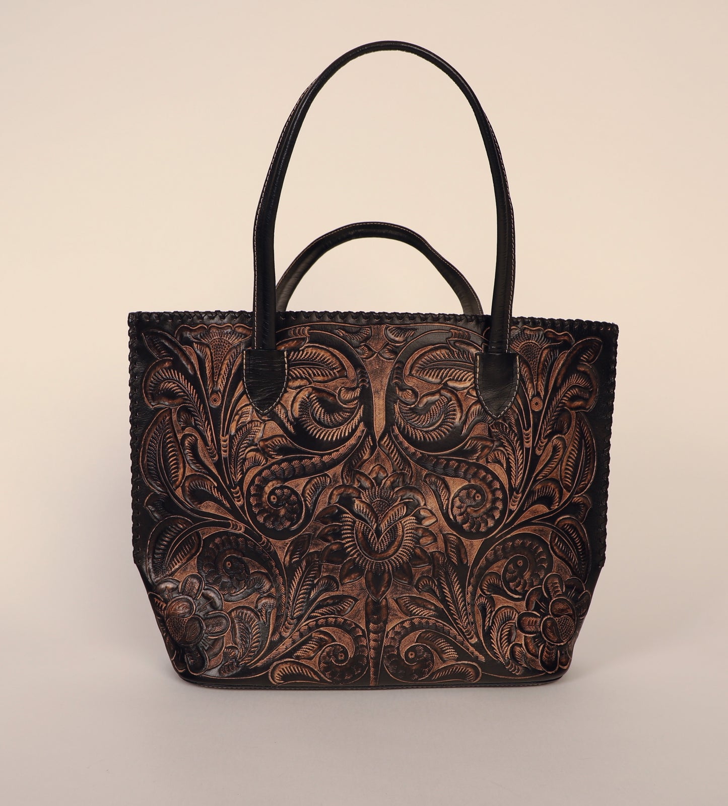 Over-sized authentic leather tote bag with traditional Mexican design etched on both sides. Fully lined with suede. Front view.